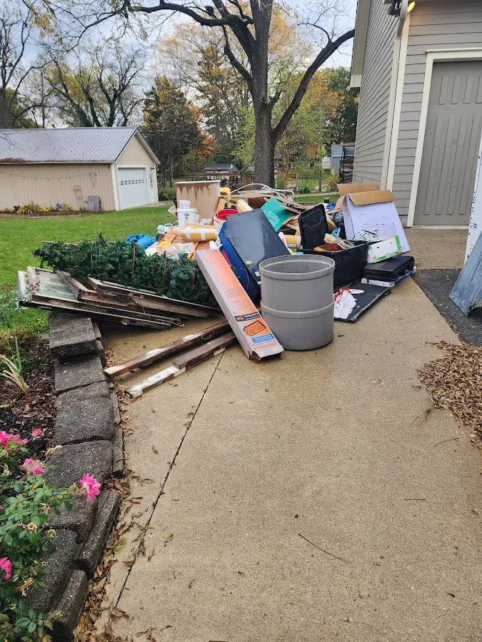 Dumpster being loaded with debris for Residential Dumpster Rental in East Port Orchard